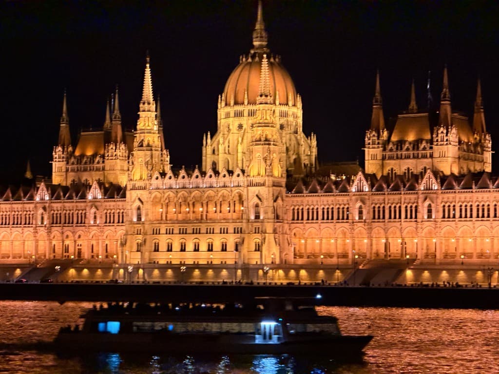 Budapest Parliament at night reflected on the Danube