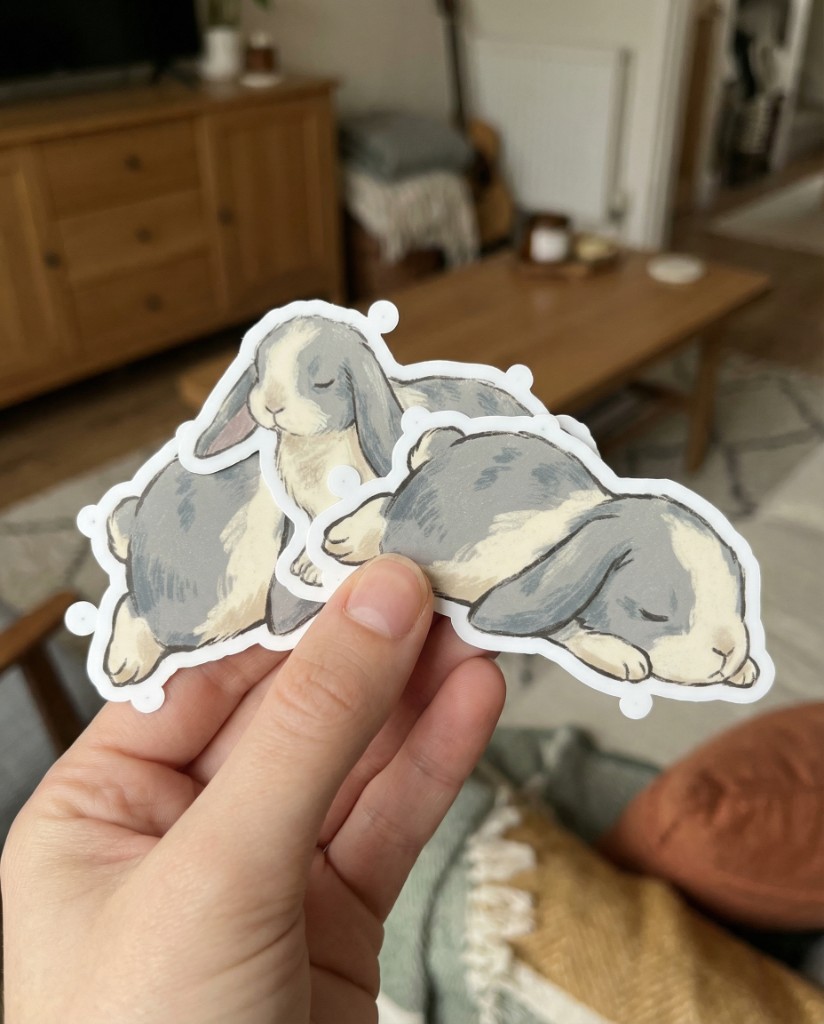 Hand holding die-cut bunny stickers